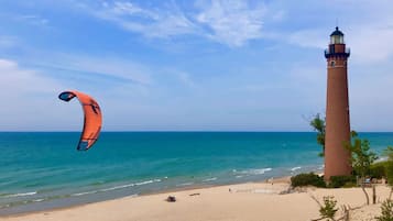 On the beach, sun loungers, beach towels