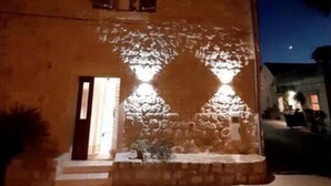 A building with a stone facade, a wooden door, and a small window. - Casa Ruben - Two Bedroom Holiday Home with Sea View (Vis)