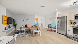 A modern apartment with a living room, kitchen, and dining area. - Stylish 1BR Apt in Aventura★Pet Friendly★Pool★BBQ (miami)