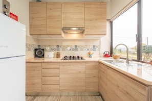 Fridge, microwave, stovetop, coffee/tea maker