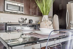 Family Condo | Private kitchen | Full-size fridge, microwave, oven, stovetop