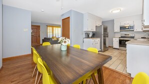 A modern kitchen with white cabinets, a built-in oven, and a microwave. - Nice and modern decor, 4BR 3BA, remodeled (Hagerstown)