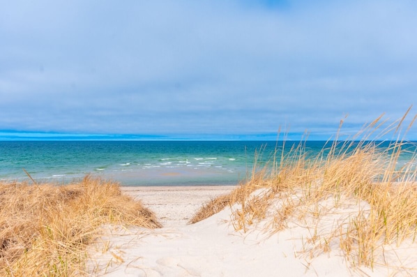 Enjoy a serene beach scene with a clear ocean view.