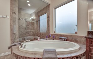 Bathtub, hair dryer, towels, soap