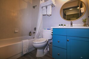 Combined shower/tub, hair dryer, towels, soap