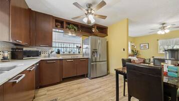 Fridge, stovetop, cookware/dishes/utensils