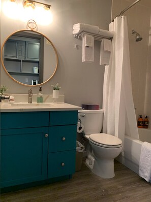 Combined shower/tub, hair dryer, towels, soap