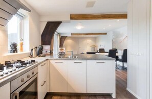 Fridge, oven, dishwasher, dining tables