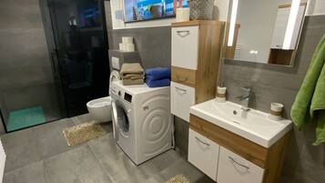 Shower, hair dryer, towels, soap