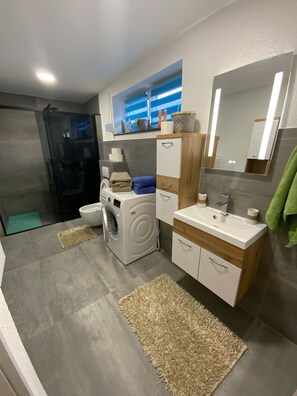 Shower, hair dryer, towels, soap