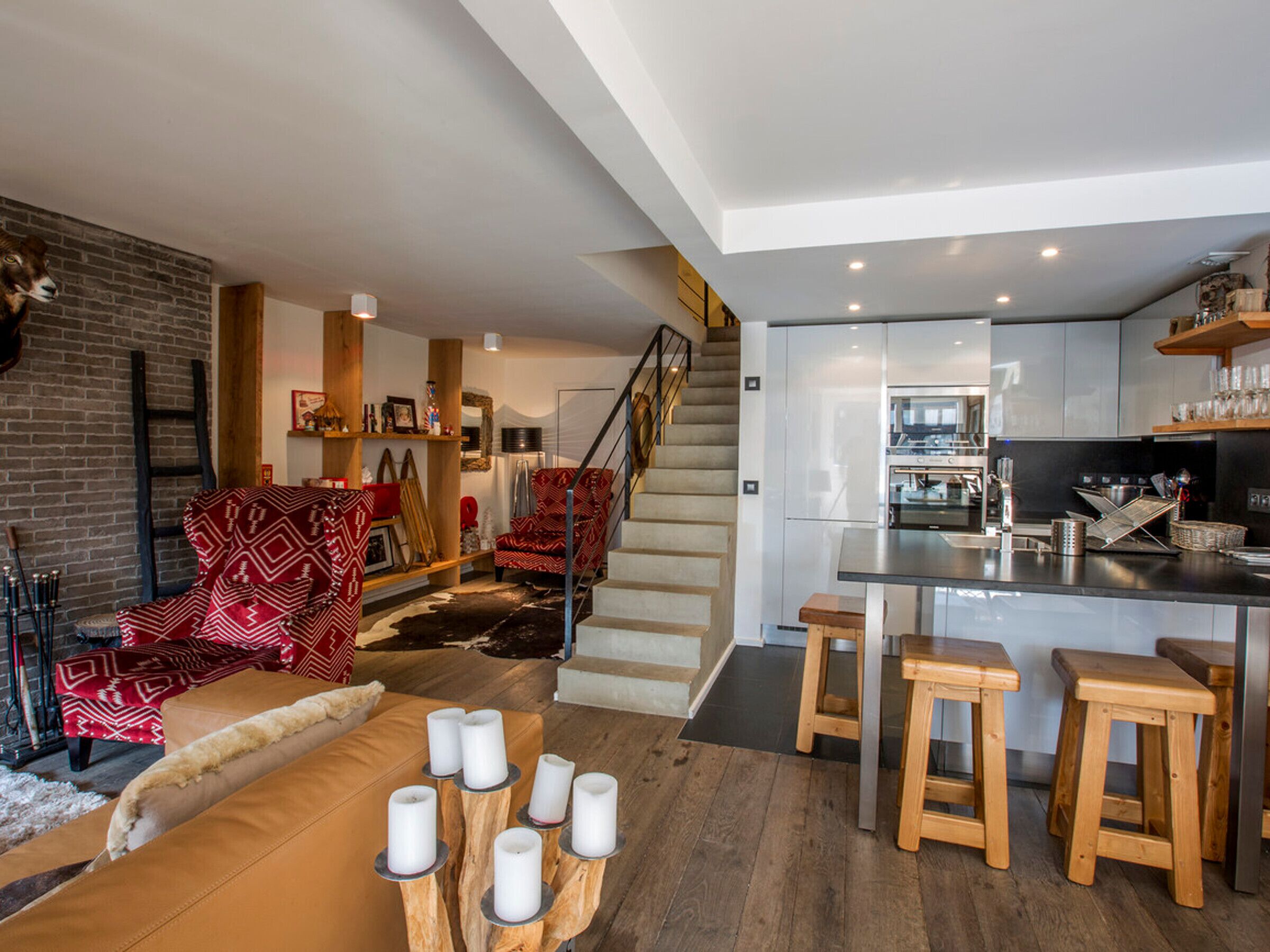 A modern interior with a kitchen, dining area, and living room.