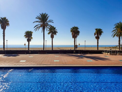 Beachfront Apartment with Parking