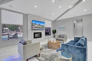 Smart TV, fireplace, table football - 6BR Modern Waterfront Villa Heated Pool Gameroom (Deerfield Beach)