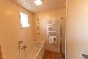 Combined shower/tub, hair dryer, towels, toilet paper
