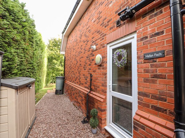 A brick house with a nameplate reading "Hafan Fach". - Hafan Fach (Mold)