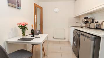 Fridge, electric kettle, toaster, cookware/dishes/utensils