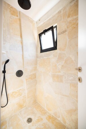 Grand Studio Suite | Bathroom | Shower, designer toiletries, towels, soap