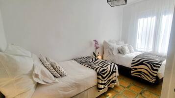 2 bedrooms, desk, iron/ironing board, travel crib