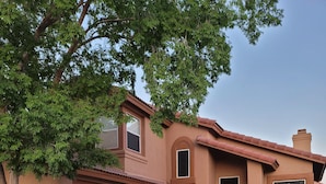 A two-story house with a brown facade, a garage, and a front door. - 3BR 2.5 baths in this Quiet and Safe Community NW of Tucson Arizona. (Tucson)