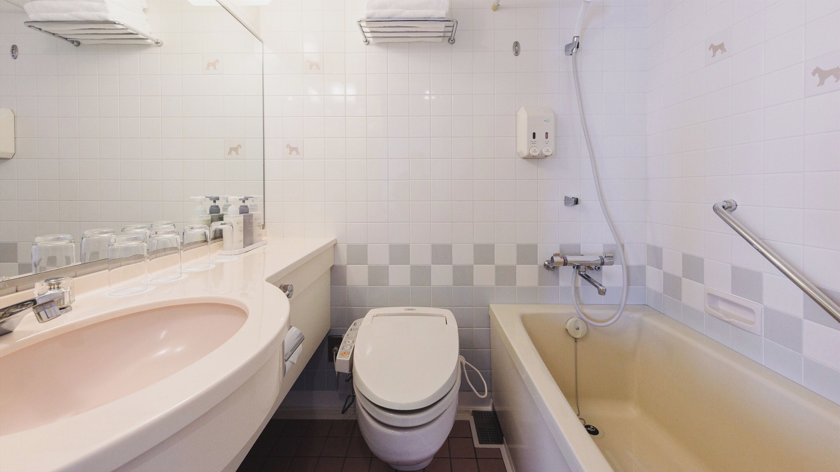 A bathroom with a sink, toilet, and bathtub.
