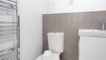 Bathtub, hair dryer, towels