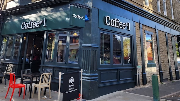 A corner building with a coffee shop named Coffee #1.