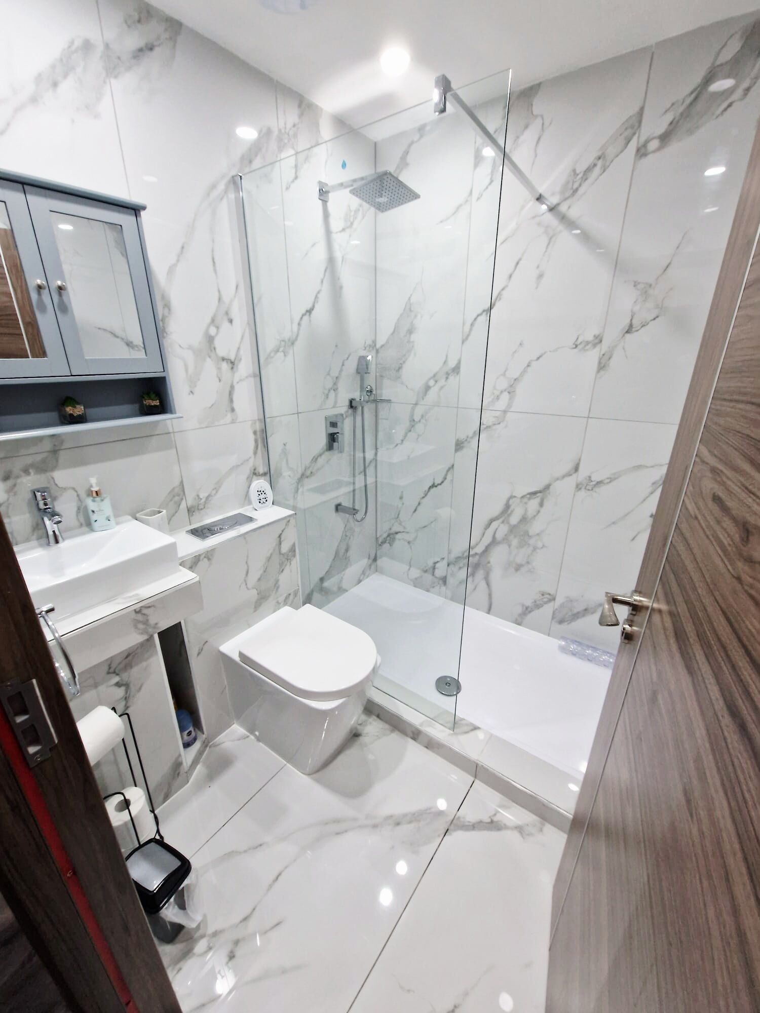 Shower, rainfall showerhead, hair dryer, towels