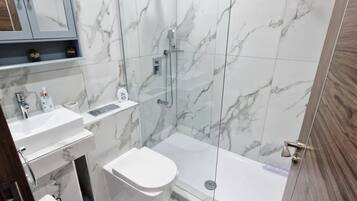 Shower, rainfall showerhead, hair dryer, towels