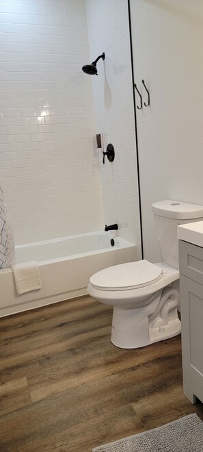 Combined shower/tub, hair dryer, towels, soap