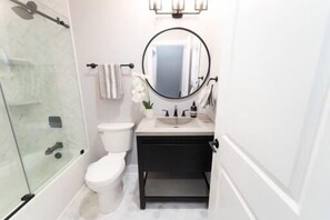 Combined shower/tub, hair dryer, towels, soap