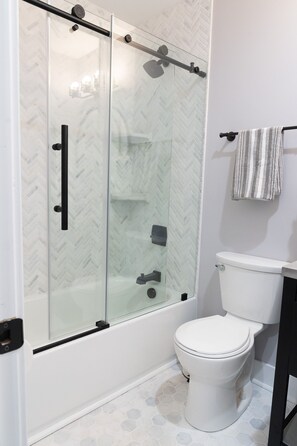 Combined shower/tub, hair dryer, towels, soap