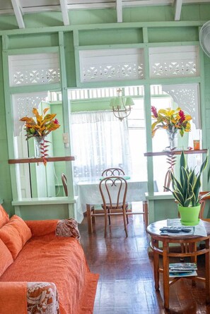 Honeymoon Suite, 2 Bedrooms, Beach View | Living area | 32-inch TV with cable channels - CHOLSON CHALETS LIMITED (Charlotteville)