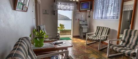 Seine Suite | Living area | 32-inch TV with cable channels