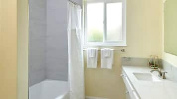 Combined shower/bathtub, hair dryer, towels, soap