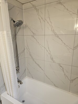 Deluxe Single Room | Bathroom | Combined shower/tub, hair dryer, towels, soap