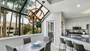 A modern kitchen with white cabinets, a built-in oven, and a microwave. - Updated 3 bedroom Villa in Shelter Cove with Community Pool (Hilton Head Island)