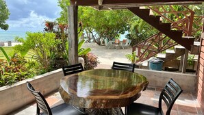 Standard Cottage | Breakfast area | Daily local cuisine breakfast for a fee - Therapy Cabins (St. George's Caye)