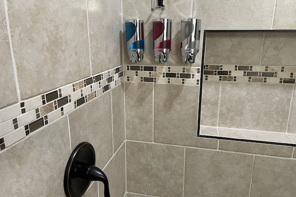 Combined shower/tub, hair dryer, towels, soap