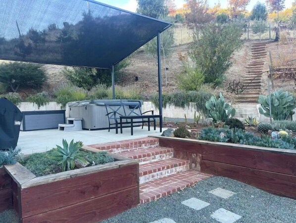 Enjoy al fresco dining on the patio, where a barbecue grill and comfortable seating area await.