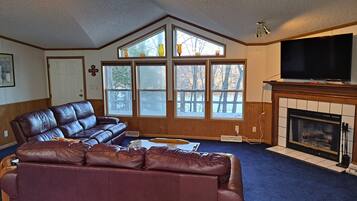Smart TV, fireplace, table football, books
