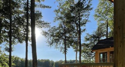 Waterfront, boats included, Cozy cabin on private lake, 25 minutes from TC.