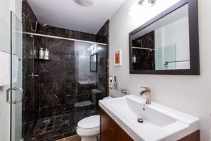 Combined shower/bathtub, hair dryer, towels, soap