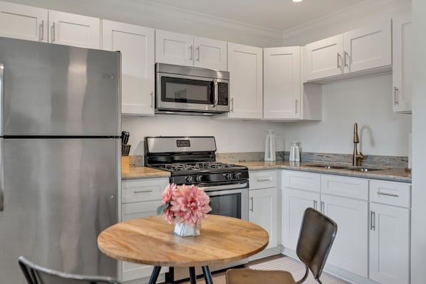 Fridge, microwave, stovetop, coffee/tea maker
