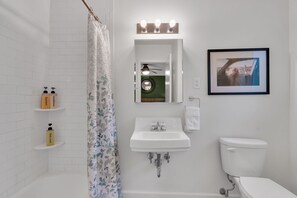 Combined shower/tub, hair dryer, towels, soap