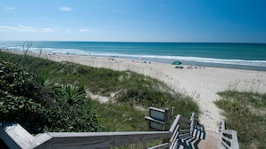 A beach with a wooden boardwalk leading to the shore, sandy beach, and ocean. - Oceanfront - The Ocean Club - Sand, Sun & Family Fun - Indian Beach/Emerald Isle (Indian Beach)