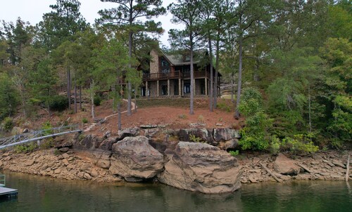 Large six-bedroom log home w/ private boat ramp, dock, movie room and pool room.