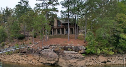 Large six-bedroom log home w/ private boat ramp, dock, movie room and pool room.