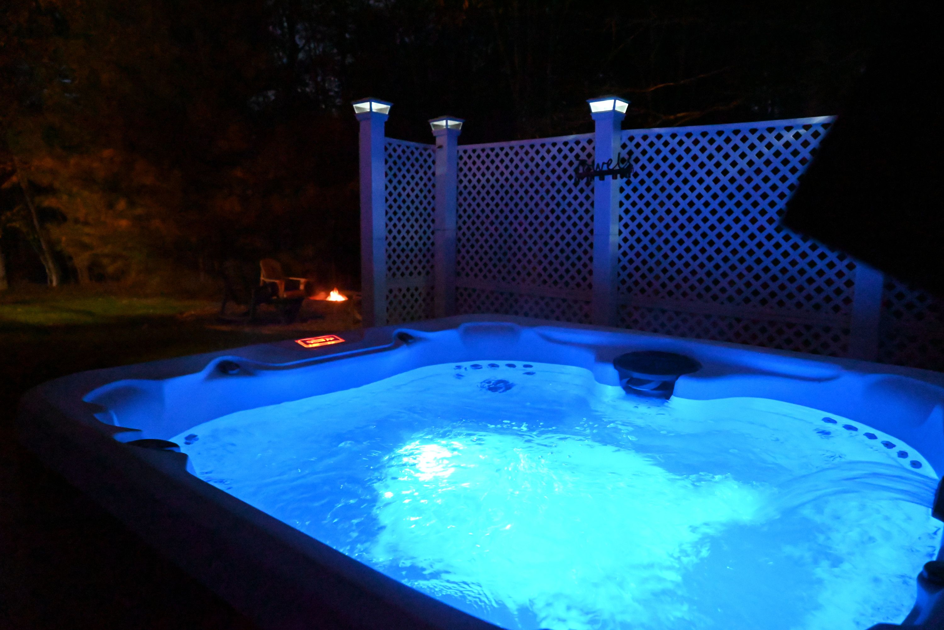 Private hot tub glowing at night