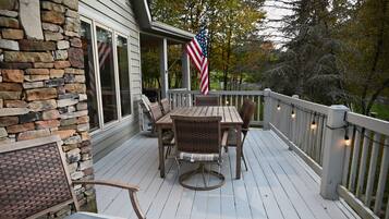 Deck with outdoor dining for six and string lights