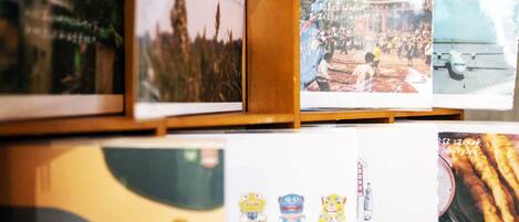 A display of various photographs and illustrations, including a group of people at an event, a building with a tower, and a plane on a runway.